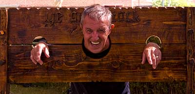 Deacon Pat Thomas locked in the stocks
