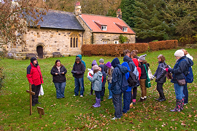 SAY praying the Stations of the Cross with the Lady Chapel in the background
