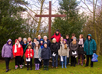 The St Andrew's Youth Team gather for photo call under the cross made from beams from the roof of the old St. Hilda's Church, Middlesbrough
