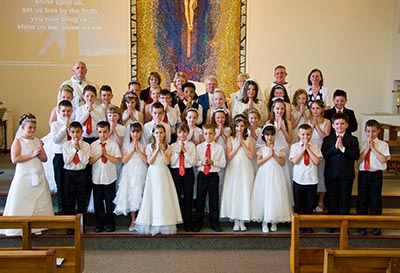 35 children made their First Holy Communion at St. Andrew's Church, Eston.
