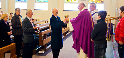 The chalice and patten are carried in the Offertory procession
