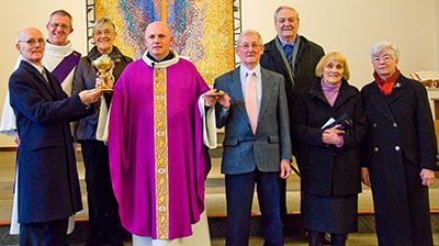 Fr. Michael Fox's family formerly present his gold chalice and patten to St. Andrew's Parish