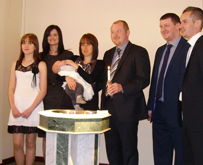 Adam and Rachel Philpot picutured with God Parents