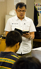 The Captain reads from Scripture